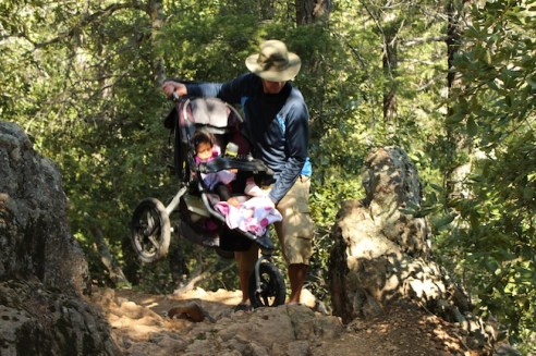 LIfting the Bpoo-Stroller combo over the difficult surface...